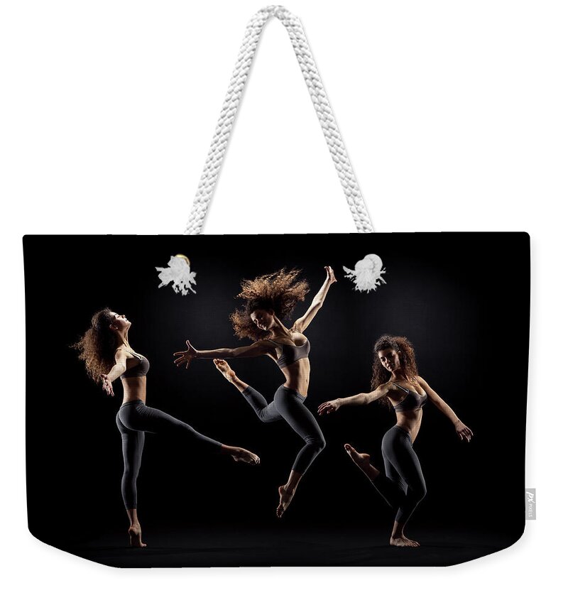 Human Arm Weekender Tote Bag featuring the photograph Dancer Pose On Black Background by Zonecreative