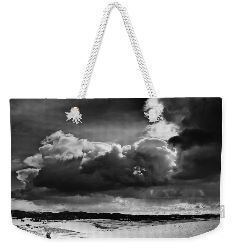 Clouds Weekender Tote Bag featuring the photograph Dark Clouds Over Snowy Landscape by Theresa Tahara