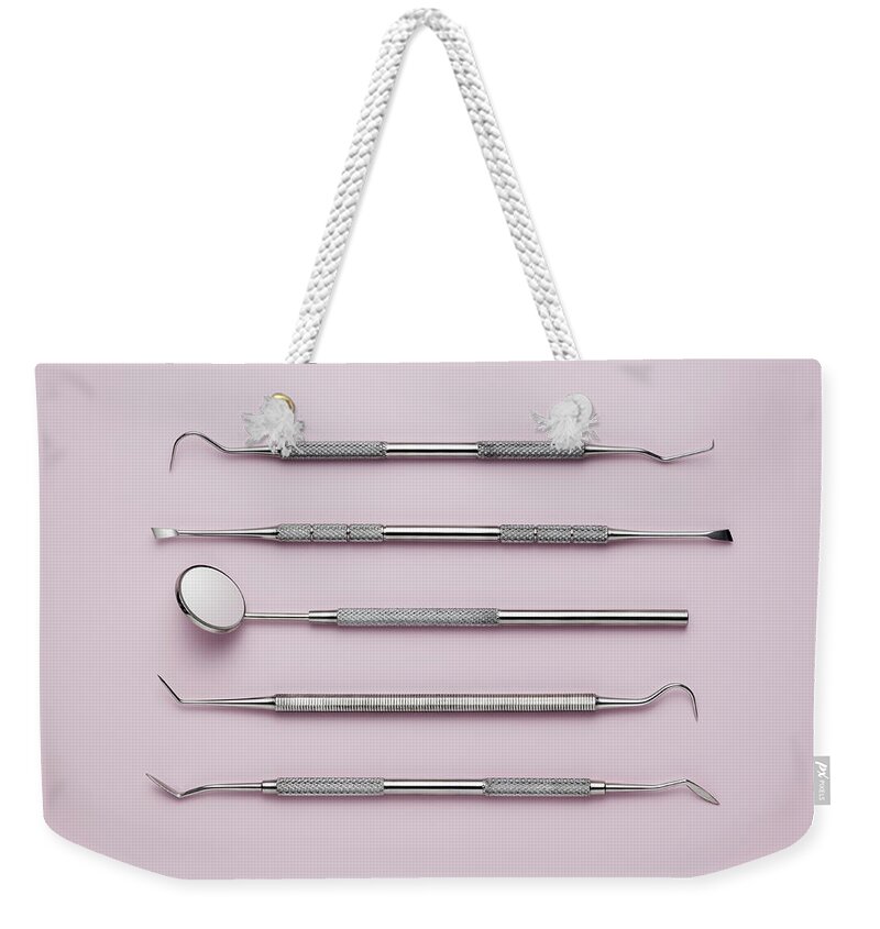 Five Objects Weekender Tote Bag featuring the photograph Dental Instruments by Jorg Greuel