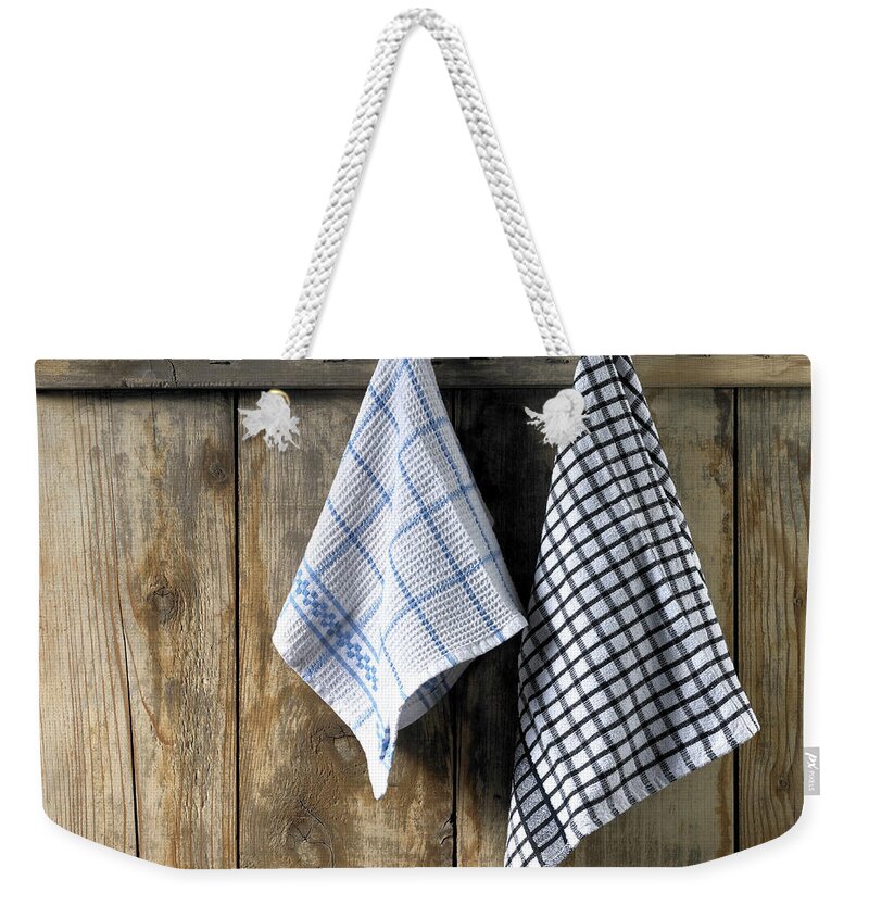 Hanging Weekender Tote Bag featuring the photograph Dishcloths Hanging by Maria Toutoudaki