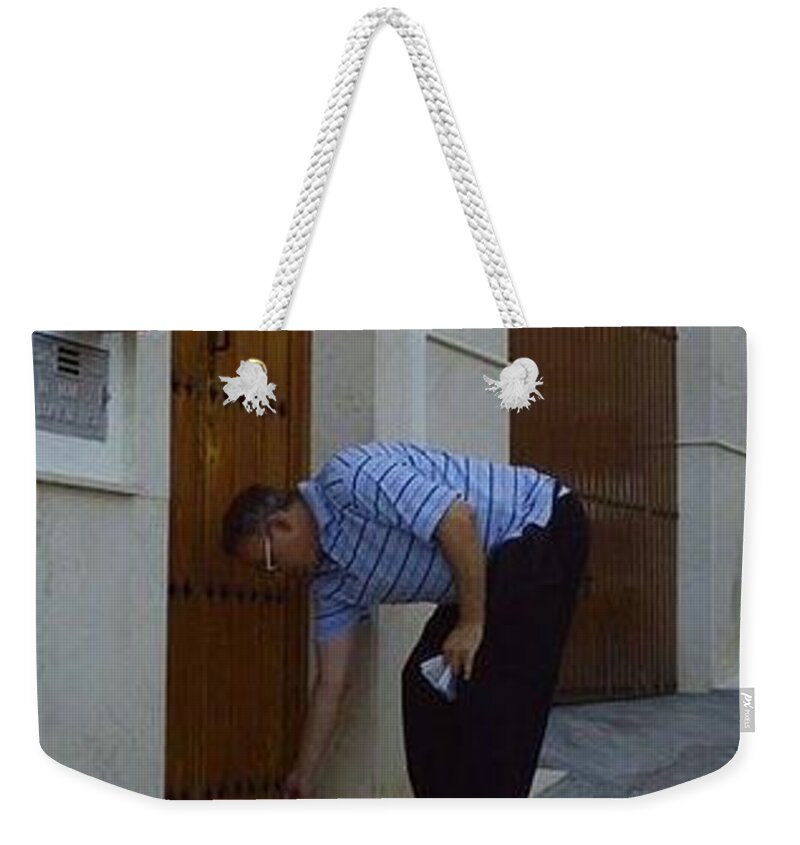 Bruce Weekender Tote Bag featuring the painting Distributing Gospel Tracts by Bruce Nutting