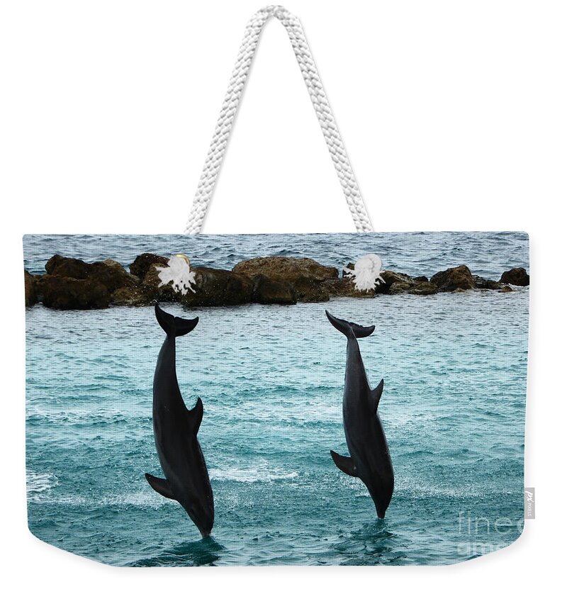 Dolphin Weekender Tote Bag featuring the photograph Upside down by Adriana Zoon