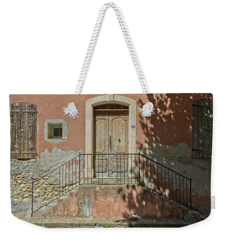 Architecture Weekender Tote Bag featuring the photograph Door and shadow by Roberto Pagani