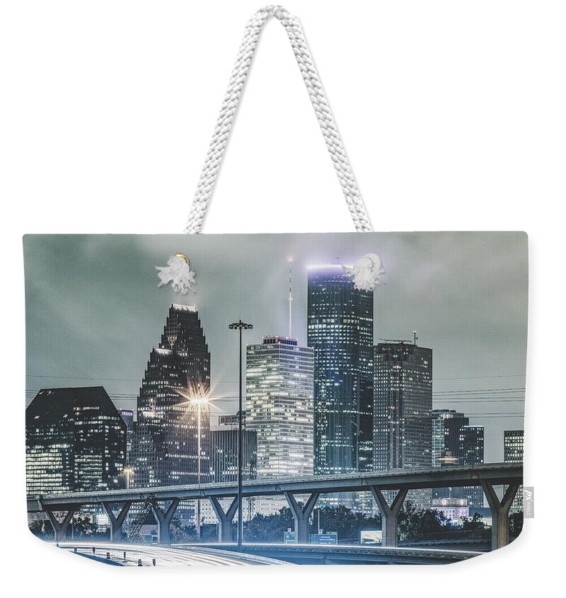 Tranquility Weekender Tote Bag featuring the photograph Downtown Of Houston In The Rain At Night by Onest Mistic