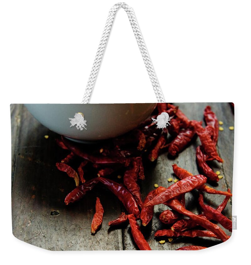 Wood Weekender Tote Bag featuring the photograph Dried Chilies In White Bowl by Lina Aidukaite