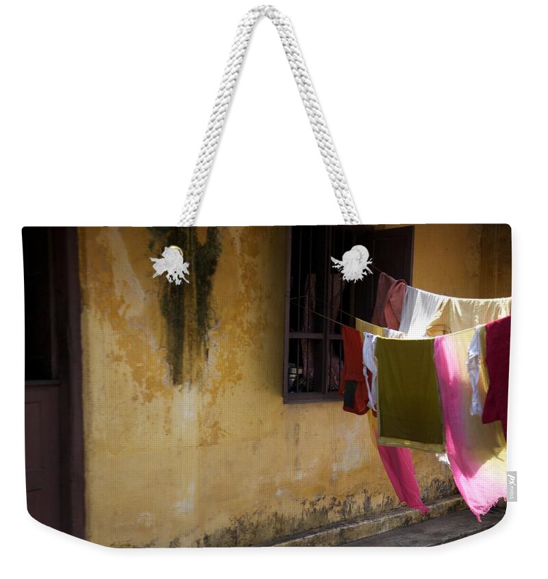 Cochin Weekender Tote Bag featuring the photograph Drying In The Sun by Lee Stickels