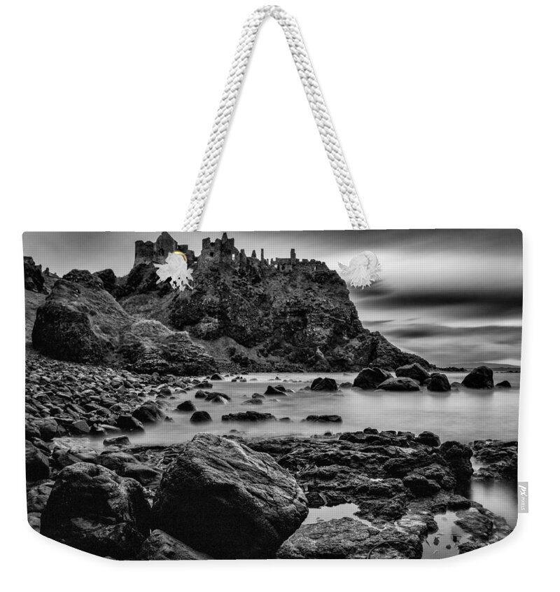 Dunluce Weekender Tote Bag featuring the photograph Dunluce Castle by Nigel R Bell