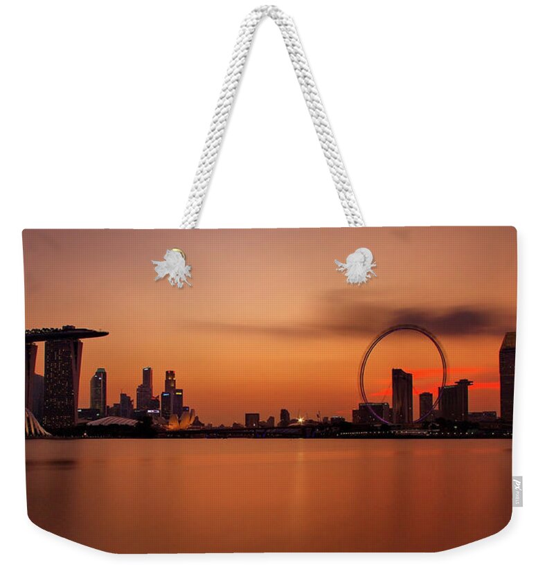 Panoramic Weekender Tote Bag featuring the photograph Dusk At Marina Bay Sands + Singapore by © Copyright Kengoh8888