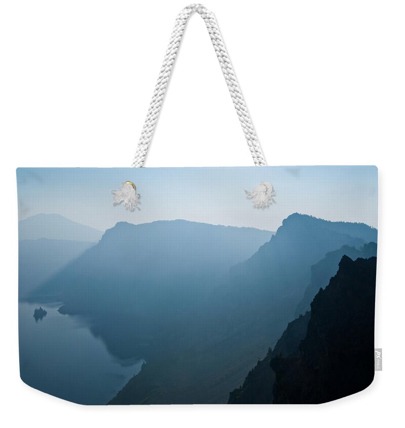 Awe Weekender Tote Bag featuring the photograph Early Morning Fog Over Crater Lake by Jeff Goulden