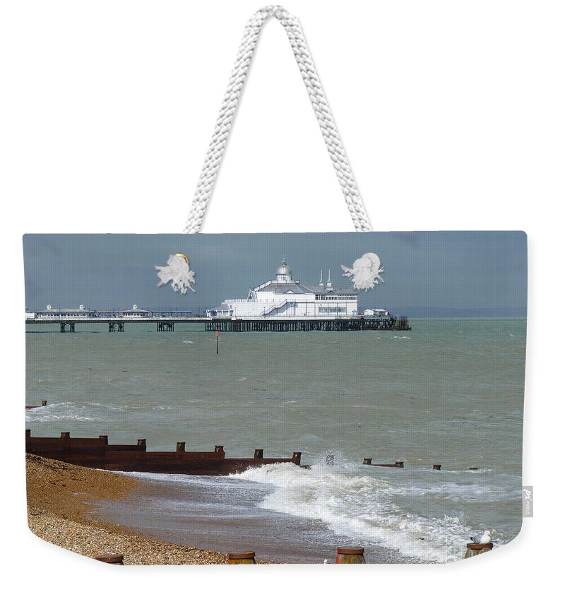 Eastbourne Pier Weekender Tote Bag featuring the photograph Eastbourne beach and pier by Phil Banks