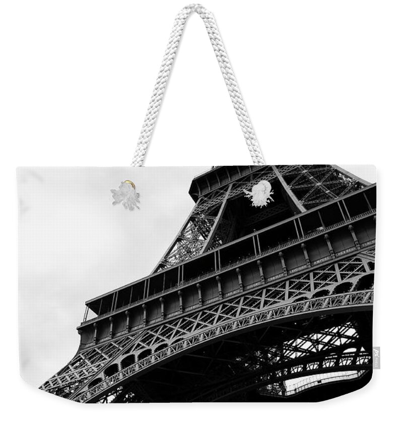 Architectural Feature Weekender Tote Bag featuring the photograph Eiffel Tower From Below Black And White by Peskymonkey