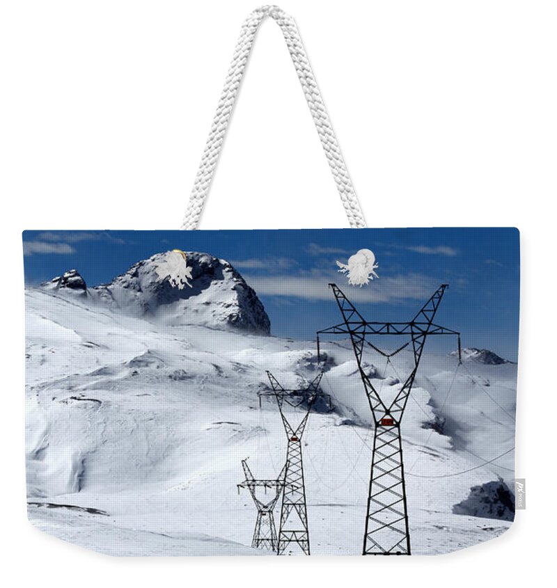 Pylons Weekender Tote Bag featuring the photograph Electricity Pylons in the Snow by James Brunker