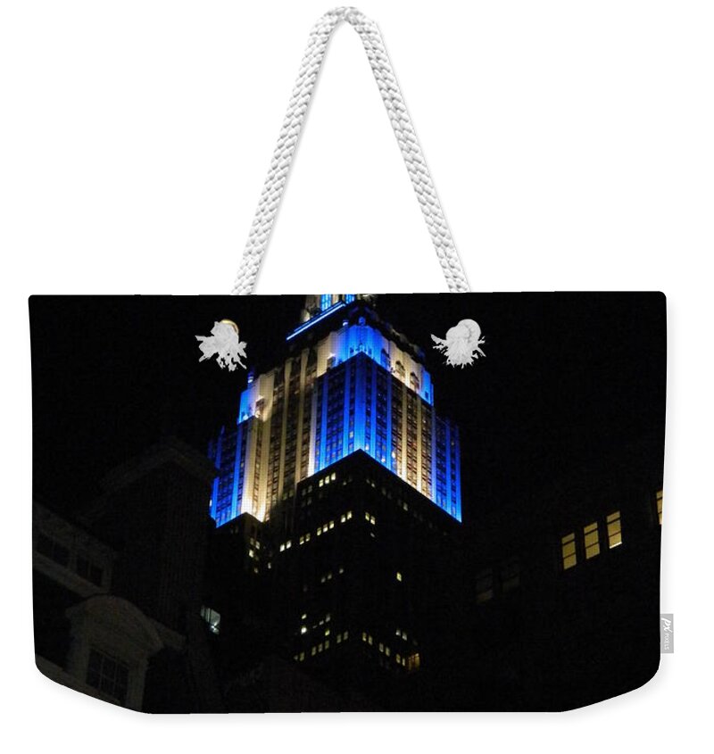 Empire State Building At Night Weekender Tote Bag featuring the photograph Empire State Building At Night by Emmy Vickers