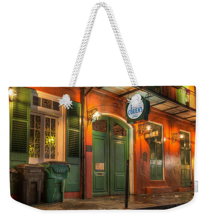 French Quarter Weekender Tote Bag featuring the photograph Fall-out from Pat O'Briens by Tim Stanley