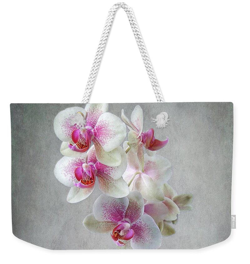 Orchids Weekender Tote Bag featuring the photograph Fancy Orchids by Louise Kumpf