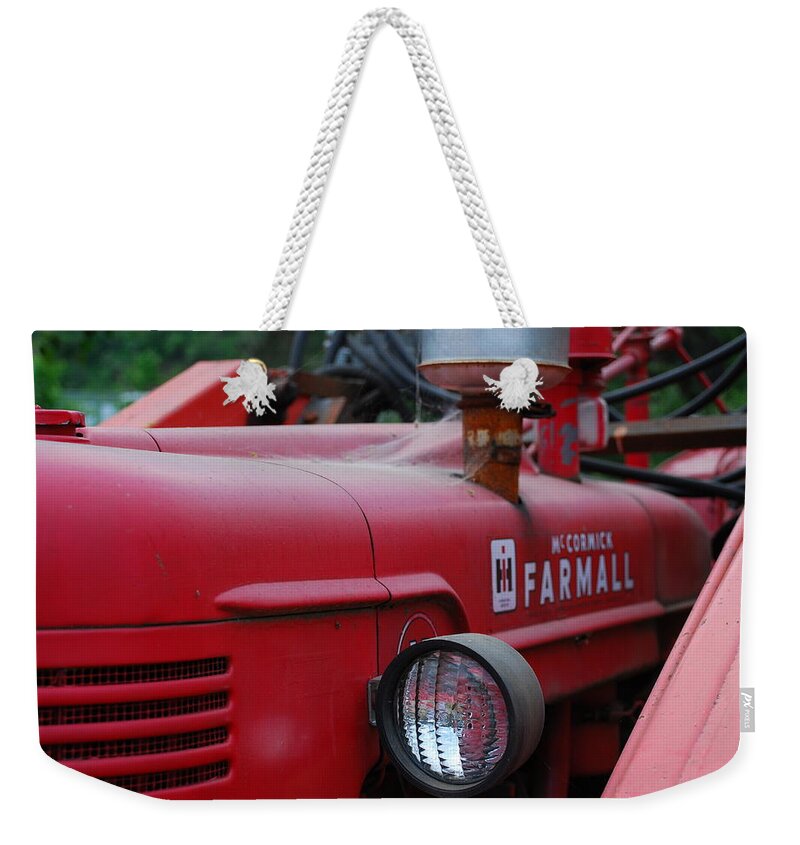 Red Weekender Tote Bag featuring the photograph Farmall Tractor by Ron Roberts