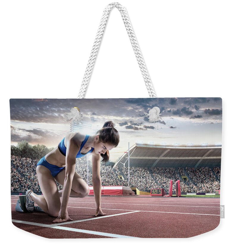 Event Weekender Tote Bag featuring the photograph Female Athlete Prepares To Run by Dmytro Aksonov
