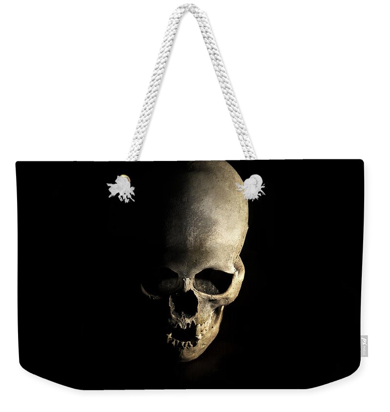 Human Weekender Tote Bag featuring the photograph Female skull by Jaroslaw Blaminsky