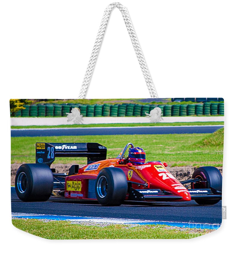 Ferrari Weekender Tote Bag featuring the photograph Ferrari at Phillip Island by Stuart Row