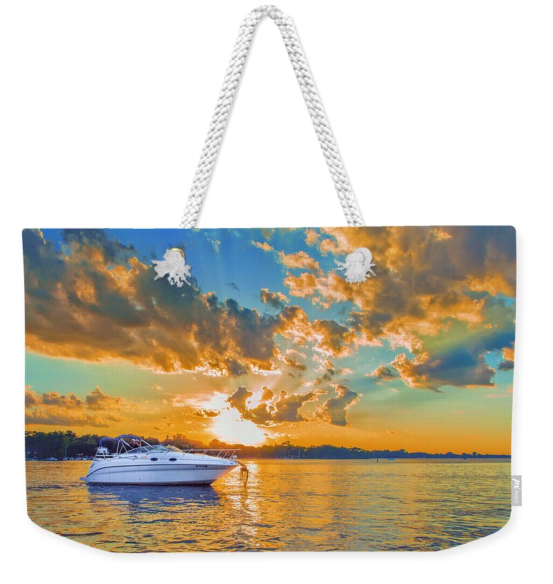 Sunset Weekender Tote Bag featuring the photograph Fiery Sunset On Lake Minnetonka by Bill and Linda Tiepelman