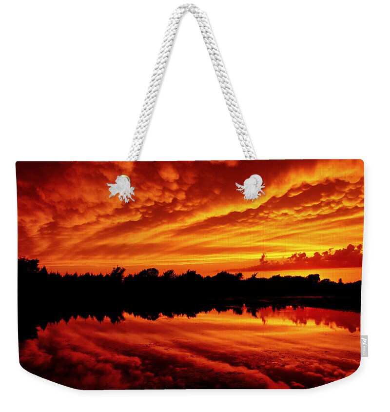 Sunset Weekender Tote Bag featuring the photograph Fire in the Sky by Jason Politte