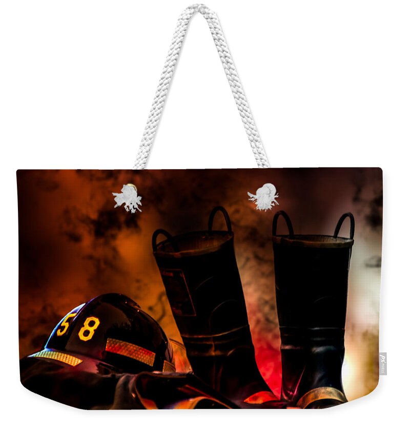 Courage Weekender Tote Bag featuring the photograph Firefighter by Bob Orsillo