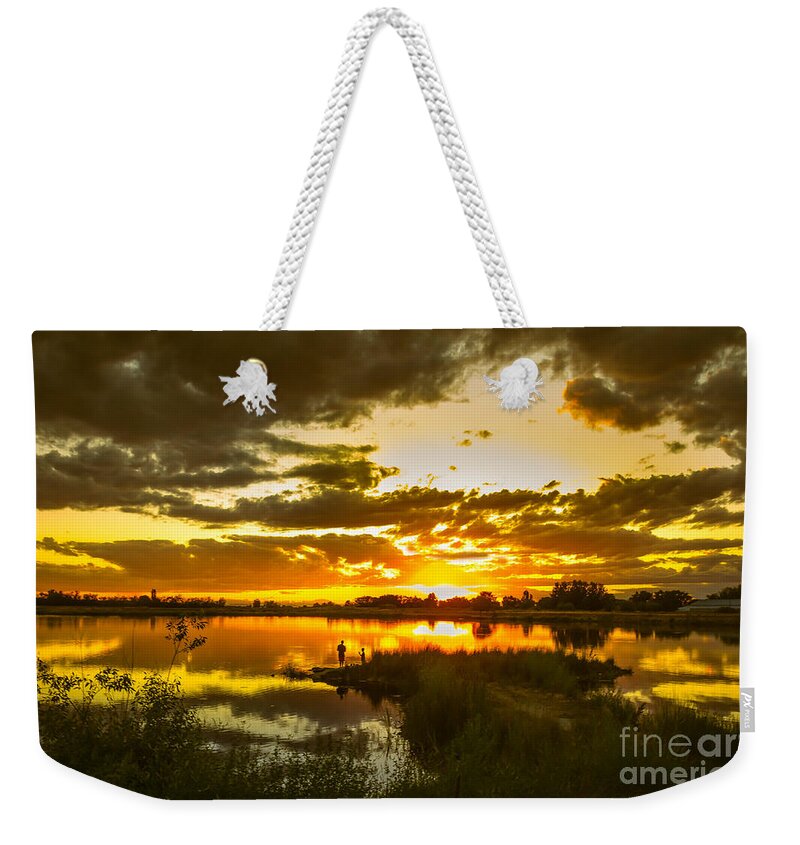 Red Weekender Tote Bag featuring the photograph Fishermen Sunset II by Robert Bales