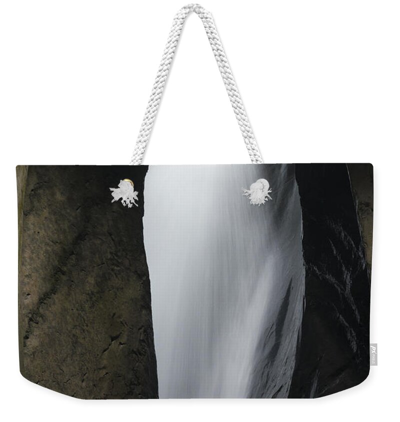 Outdoors Weekender Tote Bag featuring the photograph Flame Of Water by Philippe Sainte-laudy Photography