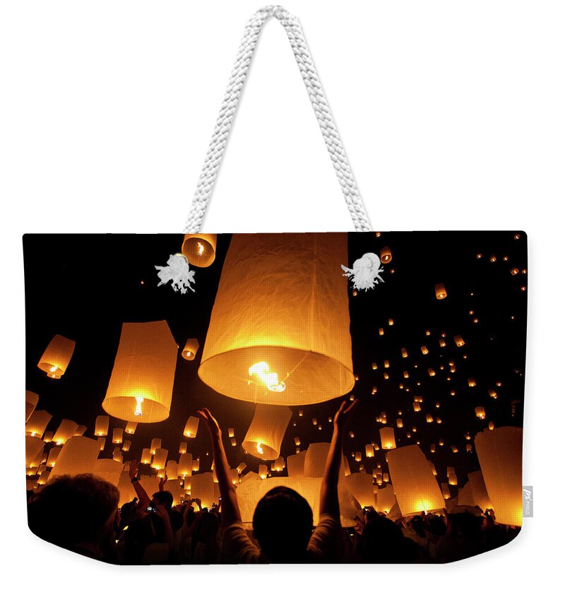 Human Arm Weekender Tote Bag featuring the photograph Floating Lantern Festival by Manachai