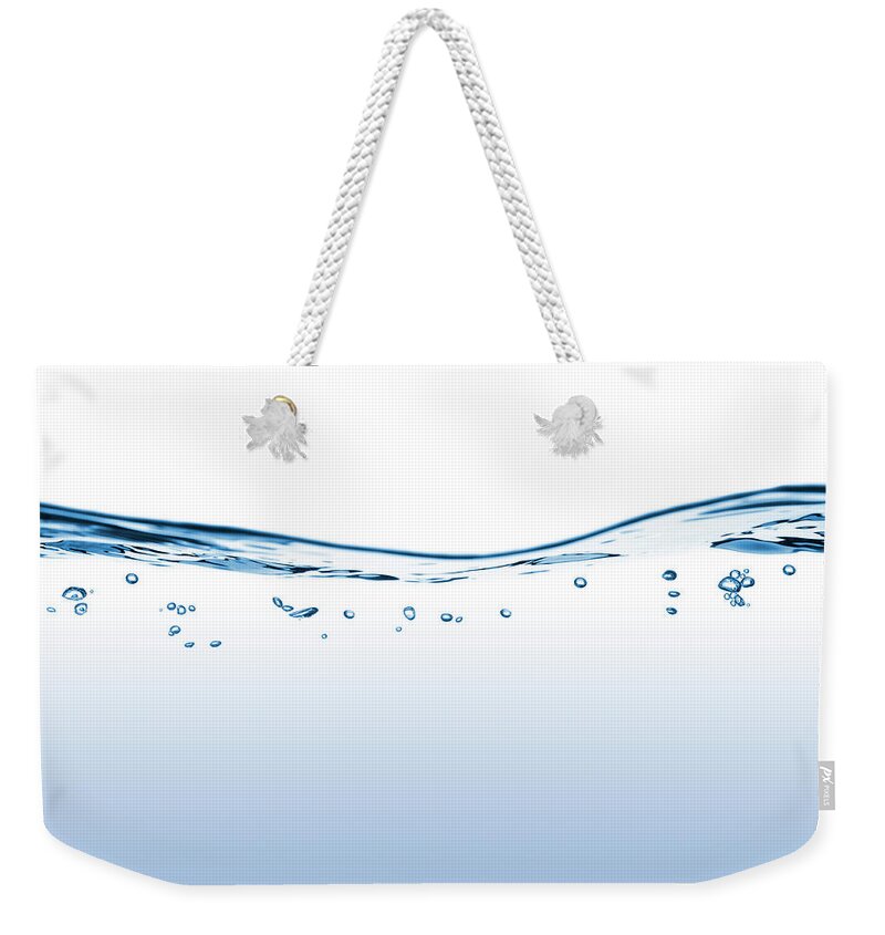 Water's Edge Weekender Tote Bag featuring the photograph Flowing Water With Bubbles by Funky-data