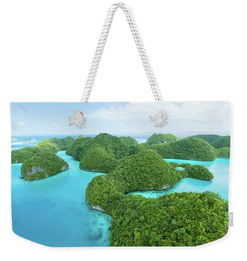 Scenics Weekender Tote Bag featuring the photograph Flying Over Lush Tropical Rock Islands by Ippei Naoi
