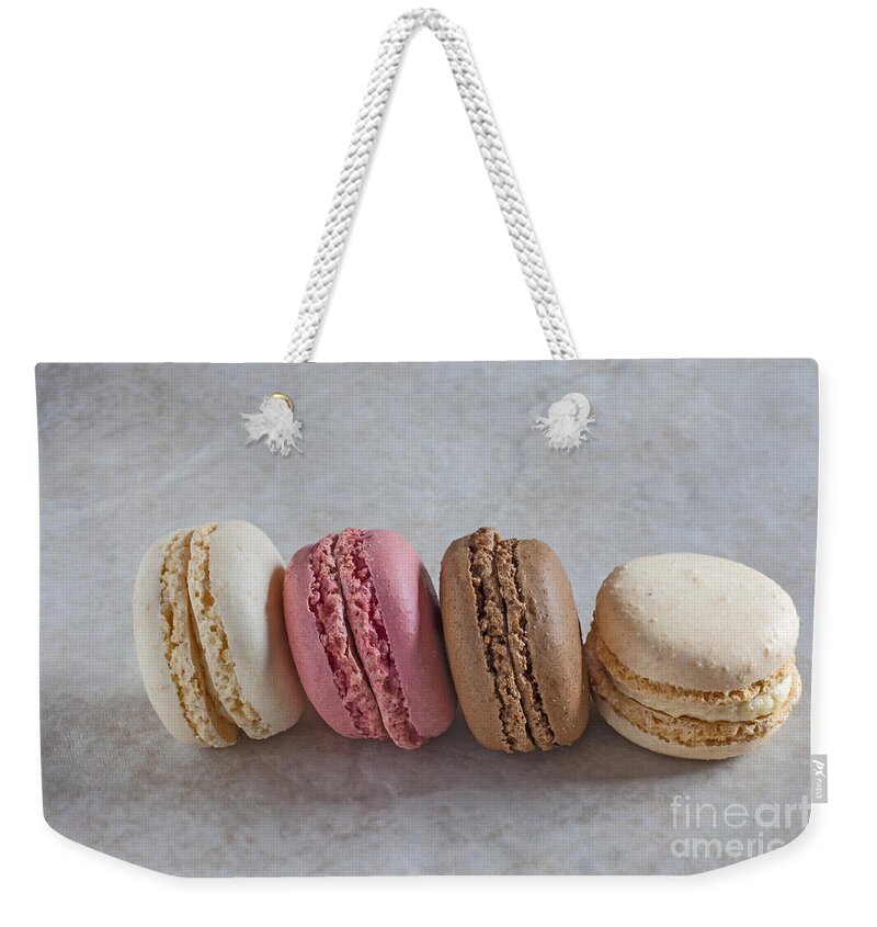 Macaroons Weekender Tote Bag featuring the photograph Four macarons in a row by Liz Leyden