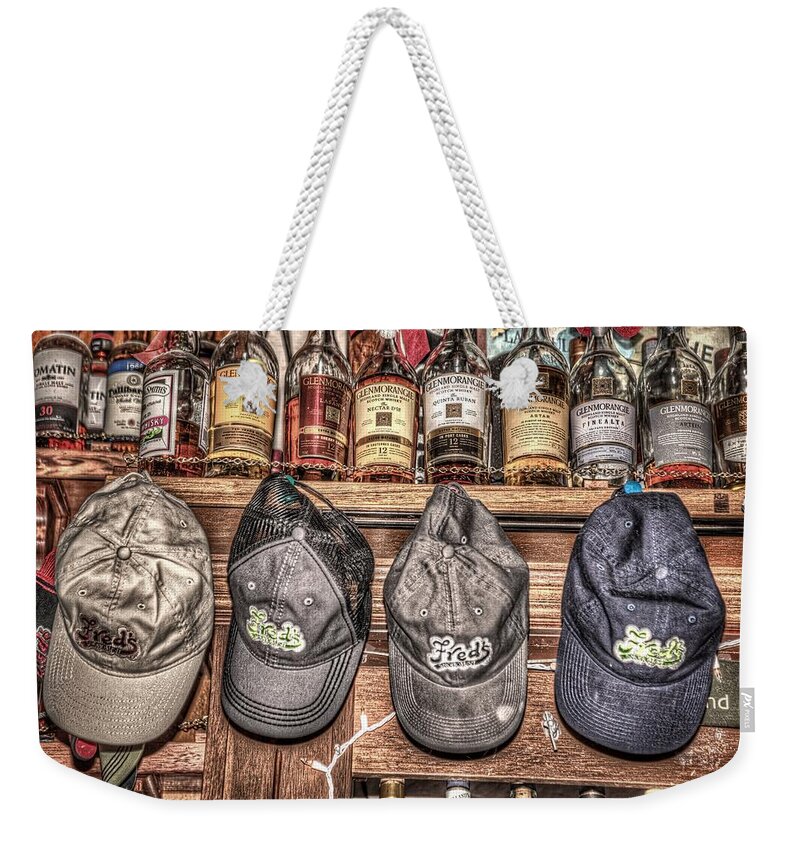 Tavern Weekender Tote Bag featuring the photograph Fred's Hats by Spencer McDonald