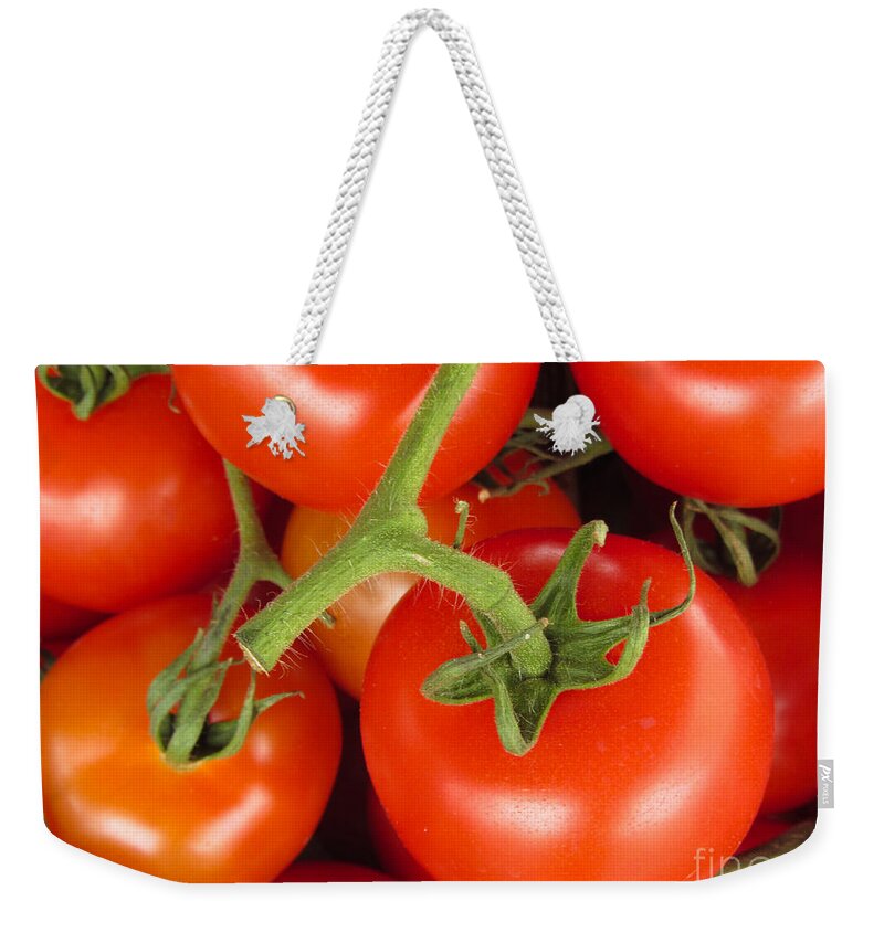 Tomato Canvas Print Weekender Tote Bag featuring the photograph Fresh Whole Tomatos on Vine by David Millenheft