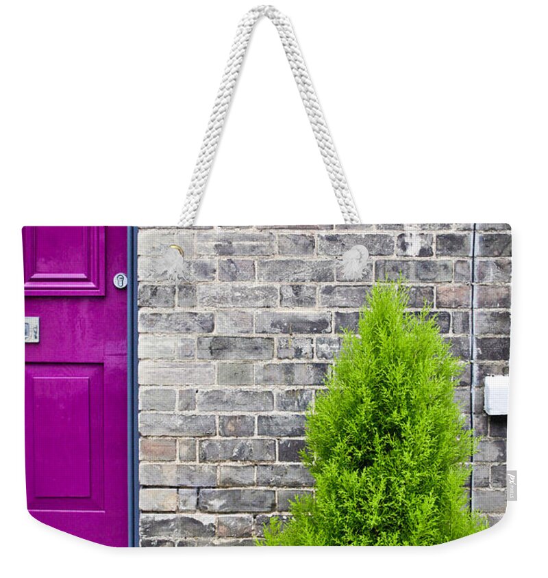 .locked Weekender Tote Bag featuring the photograph Front of house by Tom Gowanlock