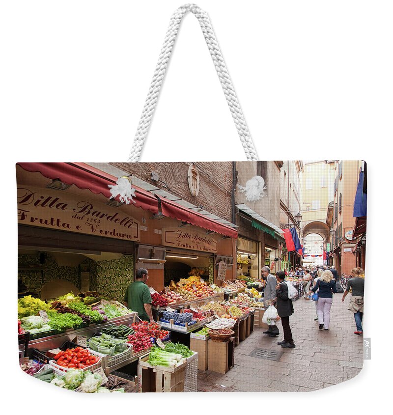 Built Structure Weekender Tote Bag featuring the photograph Fruits And Vegetables In Market In by Cultura Rm Exclusive/walter Zerla