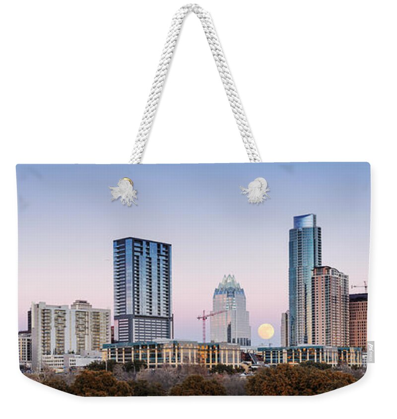 Downtown Austin Weekender Tote Bag featuring the photograph Full Moon Rising behind Downtown Austin Skyline Texas by Silvio Ligutti