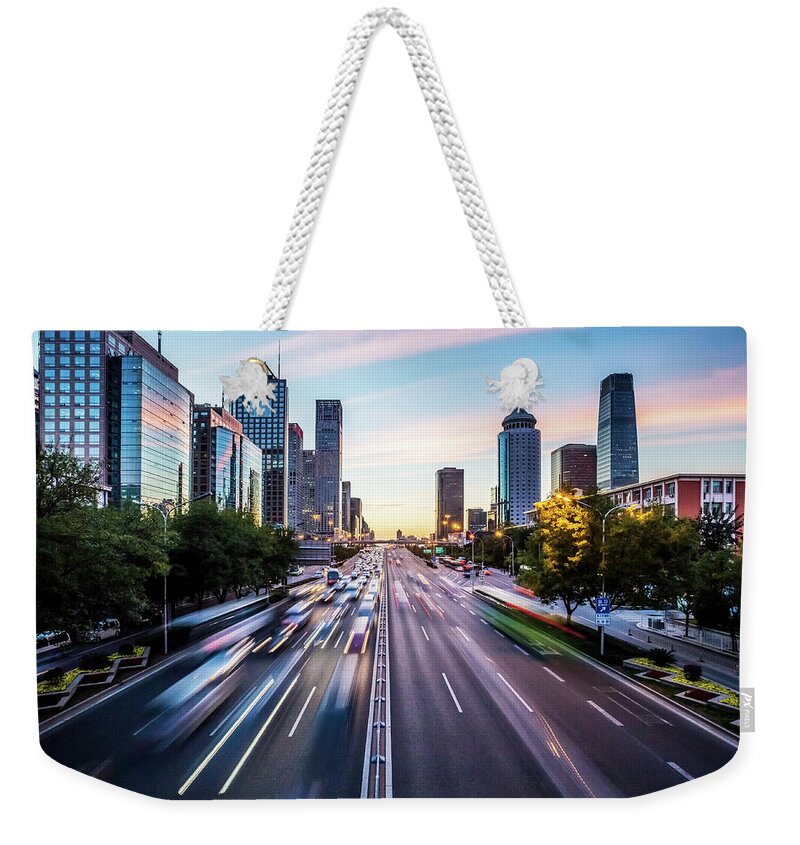 Scenics Weekender Tote Bag featuring the photograph Futuristic City At Dusk by Itsskin