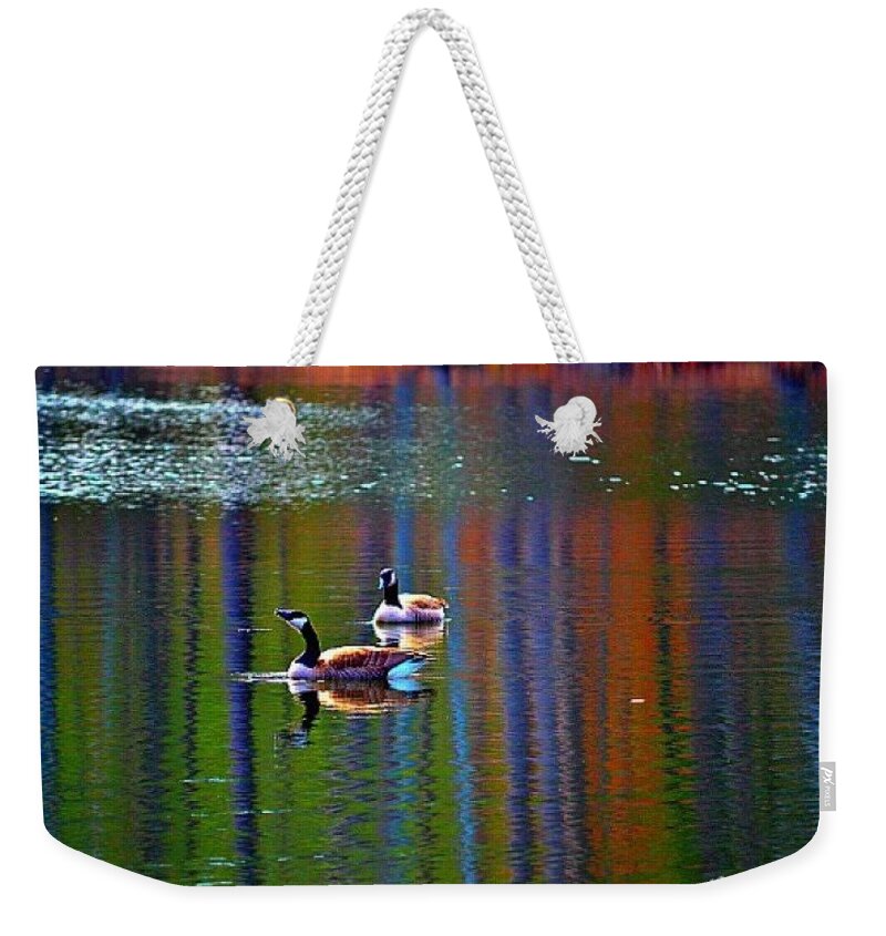 Geese Weekender Tote Bag featuring the photograph Geese on the Lake by Tara Potts