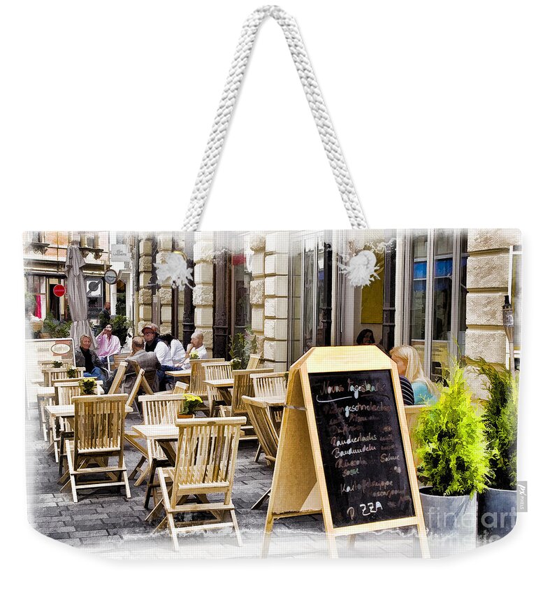 Germany Weekender Tote Bag featuring the photograph German Sidewalk Cafe by Timothy Hacker