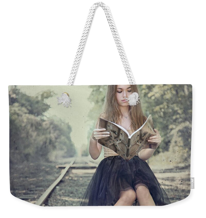 Girl Weekender Tote Bag featuring the photograph Get On The Right Track by Evelina Kremsdorf