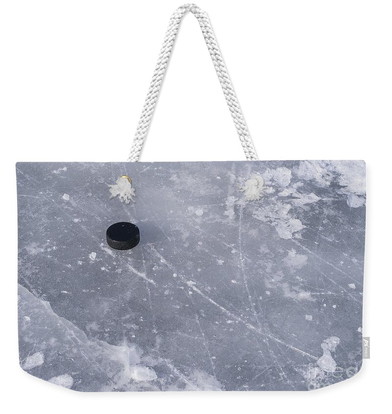 Puck Weekender Tote Bag featuring the photograph Get the puck outta here by Steven Ralser