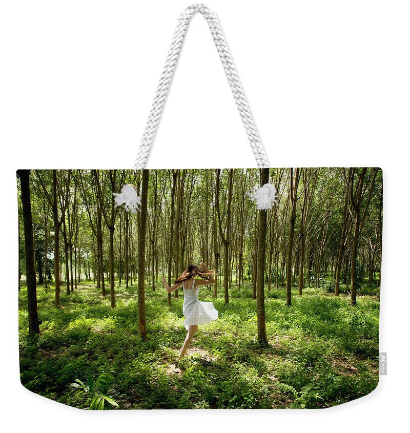 Tranquility Weekender Tote Bag featuring the photograph Girl Dancing In The Woods by Stuart Corlett / Design Pics