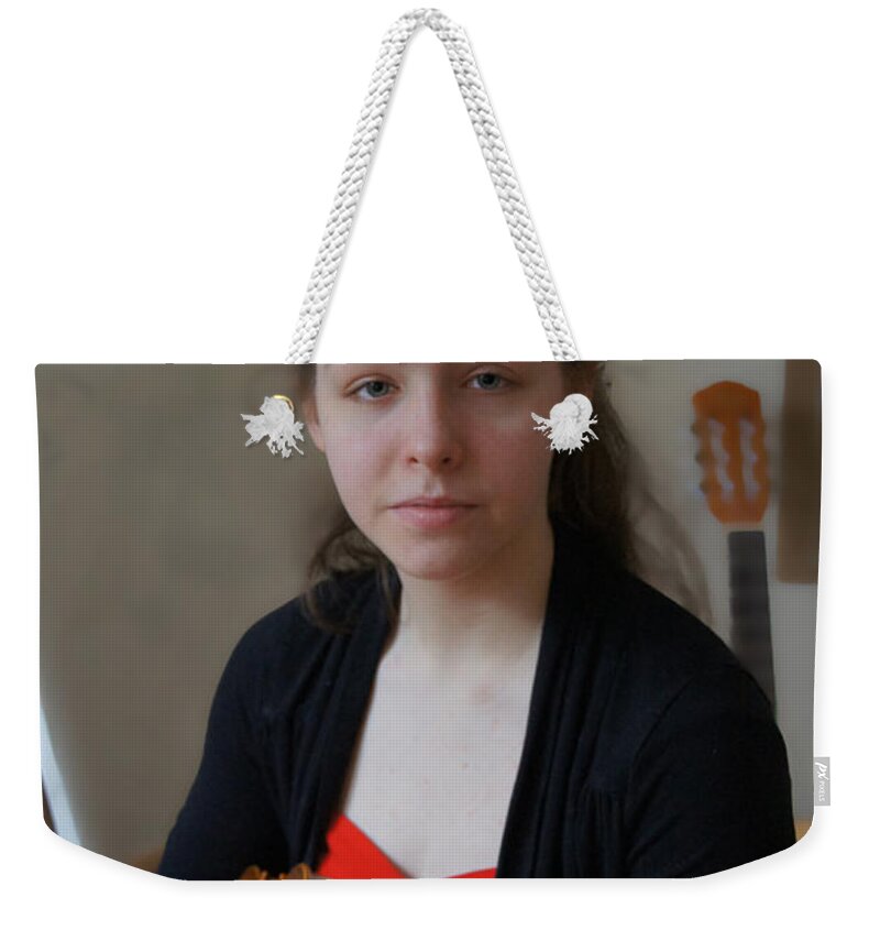 Red And Black Weekender Tote Bag featuring the photograph Girl in red and black with a violin by Elena Perelman