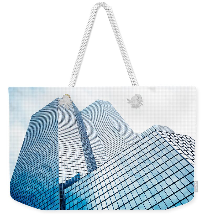 Corporate Business Weekender Tote Bag featuring the photograph Glass And Steel Skyscraper On La by Franckreporter