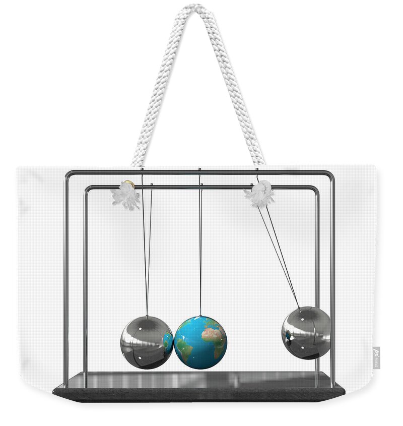 Art Weekender Tote Bag featuring the photograph Globe As Ball On Newtons Cradle by Ikon Images