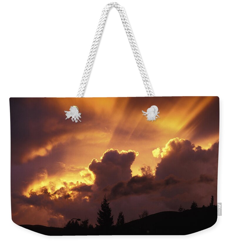 Sunset Weekender Tote Bag featuring the photograph Glorious Sunset by John Clark