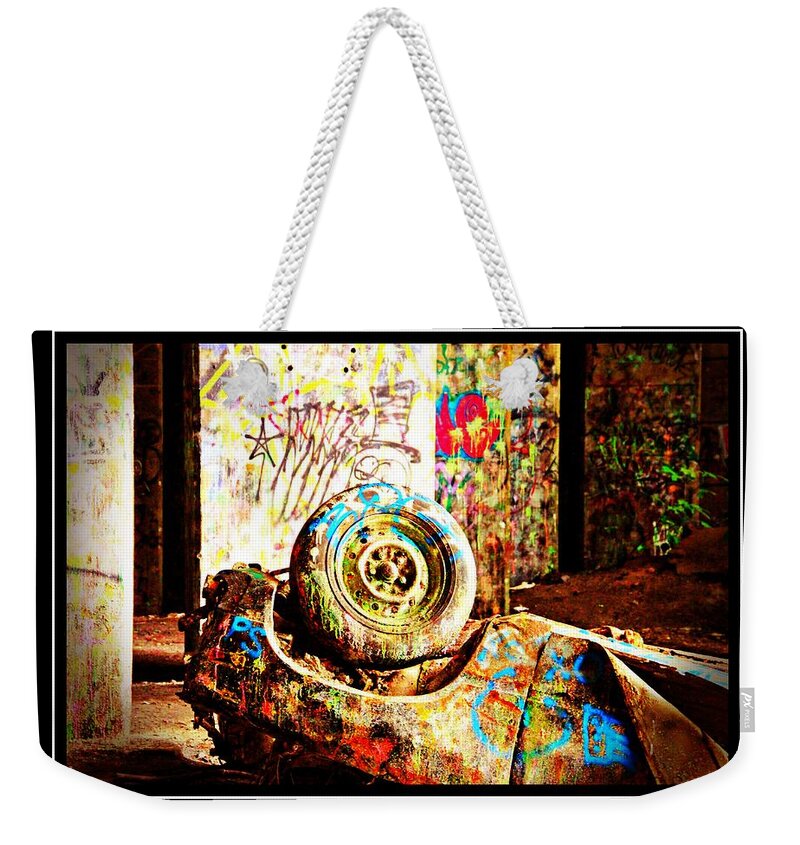 Grafitti Bridge Weekender Tote Bag featuring the photograph Grafittied Car Upside Down by Alice Gipson