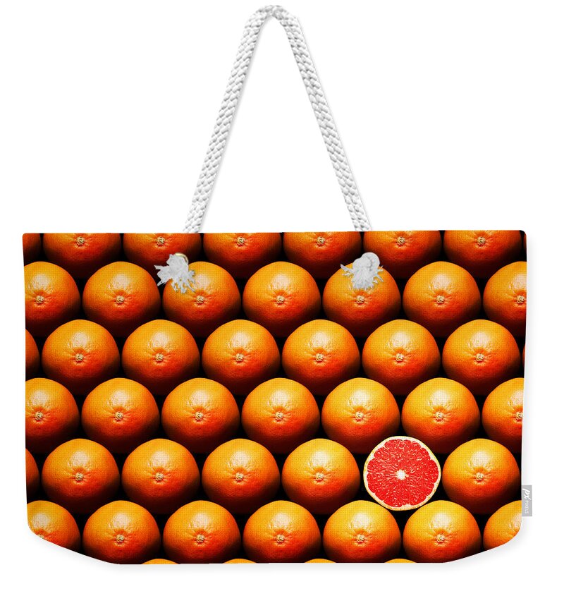 Grapefruit Weekender Tote Bag featuring the photograph Grapefruit slice between group by Johan Swanepoel