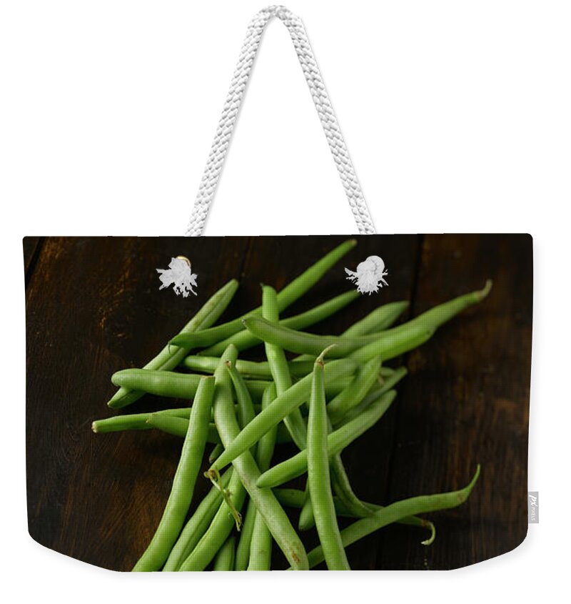 Wood Weekender Tote Bag featuring the photograph Green Beans On Wooden Table, Close Up by Westend61